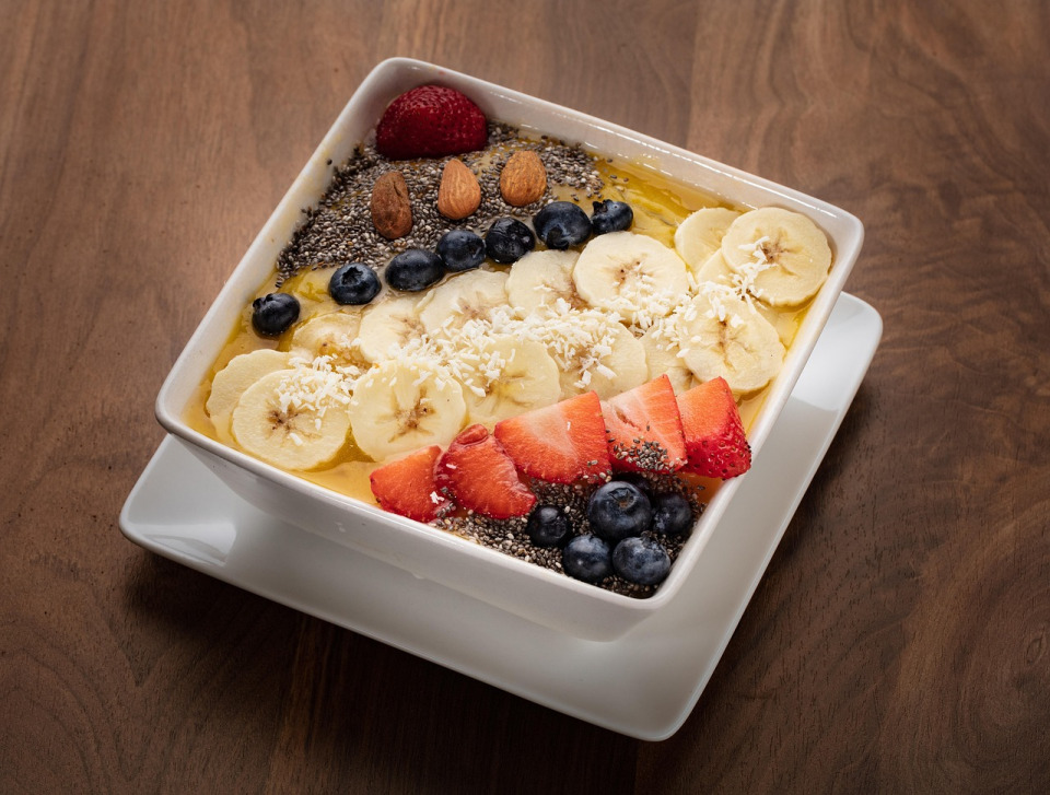 Hemp smoothie bowl topped with seeds and fruit