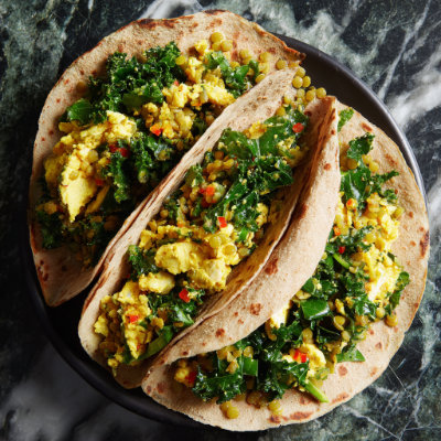 A whole-grain wrap with eggs, lentils, and kale, on a white background with a NutrientShield logo.
