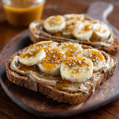 A jar of sunflower seed butter with a spoon.