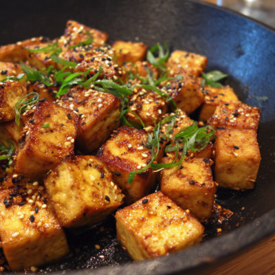Firm tofu sliced with soy sauce.